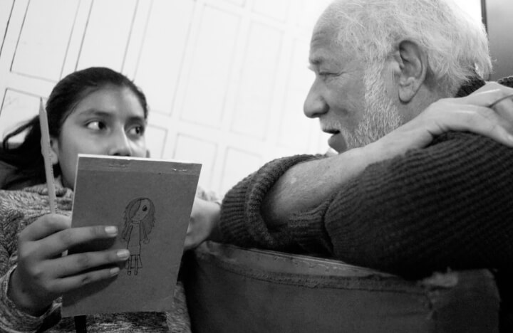 Michael Ondaatje working with a young writer.